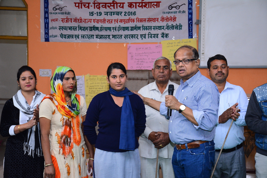 Dr Kamal Kar with one of the NL who emerged during the triggering excercise in the village. A school girl who has decided to stop open defecation in her village.